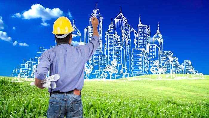 ingegnere che disegna una città